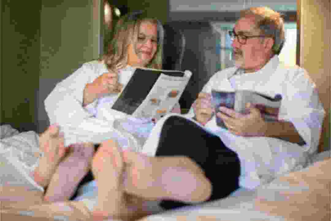 Blurred and Pixelated image of a couple reading magazine